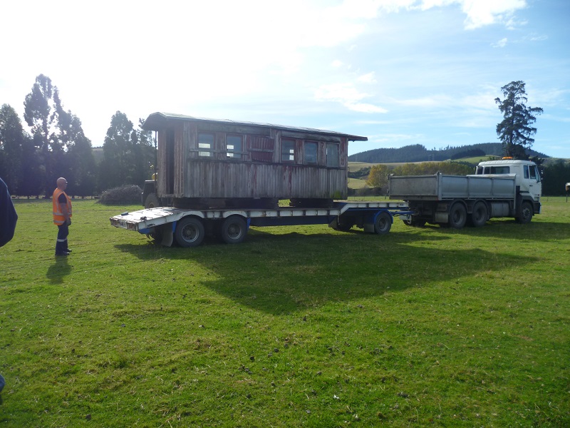 Half of carriage A255 being recovered from a farm on the Taieri Plains, Dunedin.