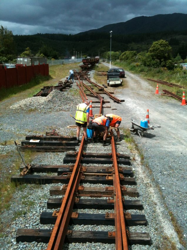 Lionel, Peter, John and Colin working on double slip and road 2 turnout on Saturday 24 November.