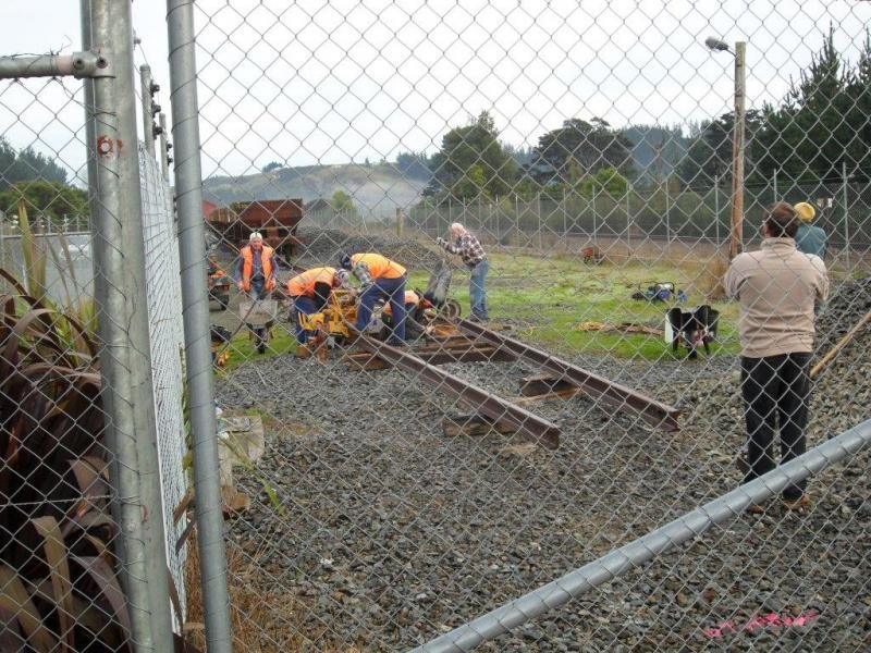 View through the crossing gates at the advancing head of steel. Photo:Glenn Fitzgerald.