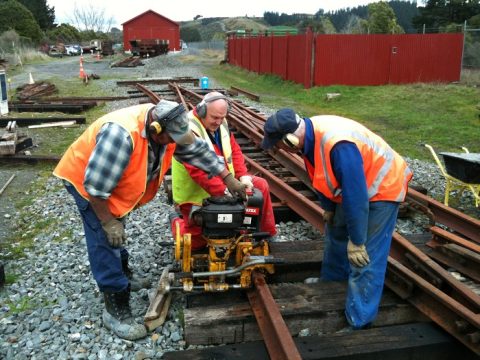Colin, Peter and John drilling heel bolt holes in outer slip rail