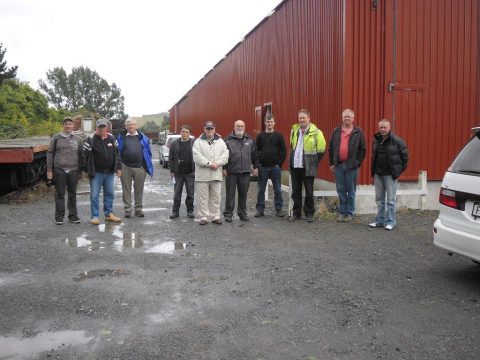 FRONZ Executive team along with Ben Calcott and Hugh McCracken pause for a photo by the rail vehicle shed