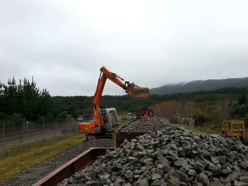 A view along the rake of ballast wagons during loading. Photo: Ben Calcott