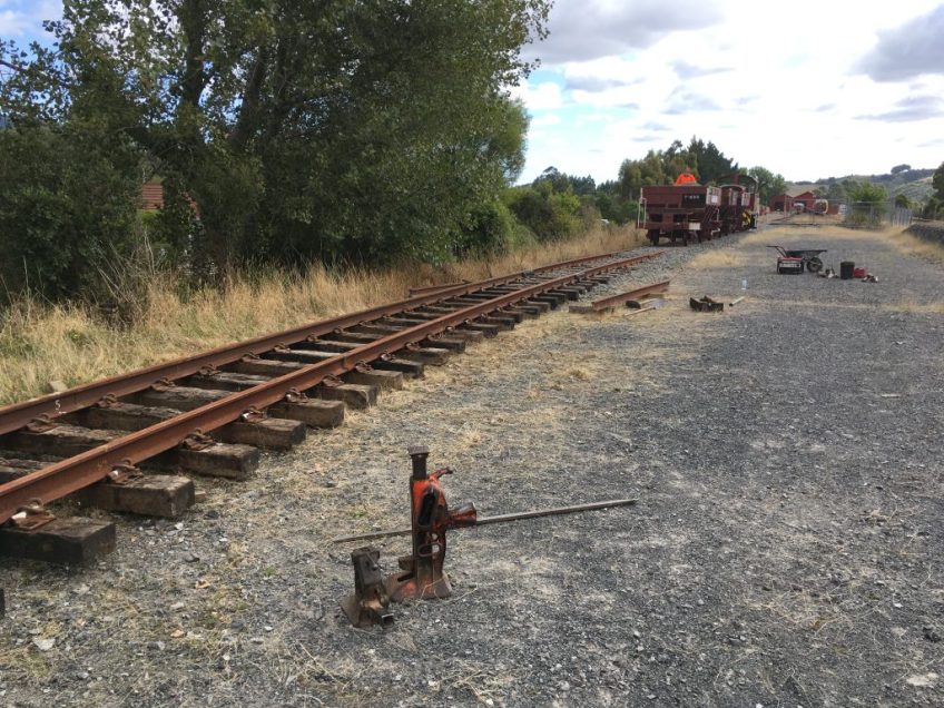 Ballast train approaching the newly laid track